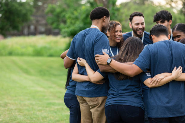 istock Diverse support group stands close together in the park 1505560723