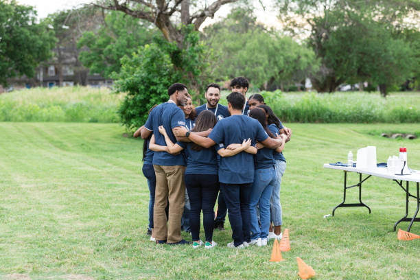 istock Diverse group of volunteers huddle in unity to support each other 1505560733