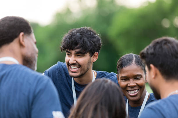istock Diverse group of people laugh and enjoy conversation with each other 1505560737