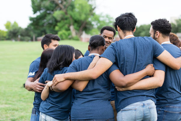 istock Multiracial group of people stand in a huddle and talk 1505560742