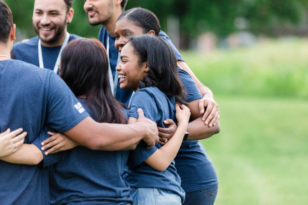 istock Diverse volunteer team smiles and enjoys conversation with each other 1505560747
