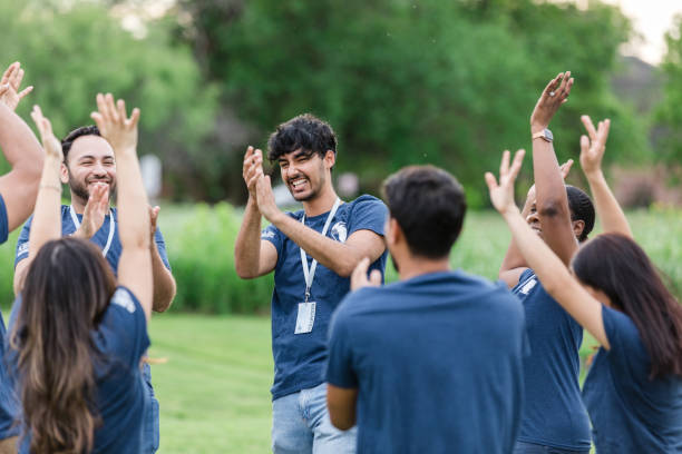 istock Multiracial group of volunteers smile and cheer 1505560751