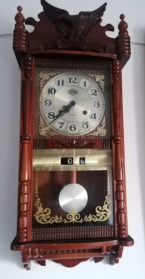 Old wooden wall clock.  Cuckoo clock