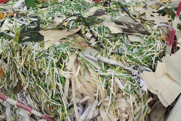 istock Waste pile for recycling on sorting plant. Technology reuse materials. Stack of shredded paper. Save the planet ecology concept. Industry reduced pollution factory 1505590277
