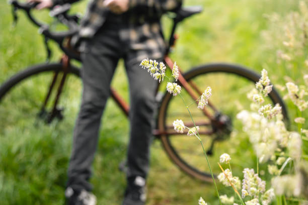 istock A man riding with a bike on a summer forest road. 1505593645