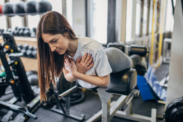 istock Young fit woman exercising in gym 1505594970