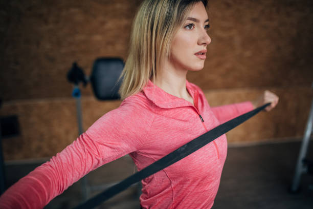 istock Young fit woman exercising in gym 1505595306