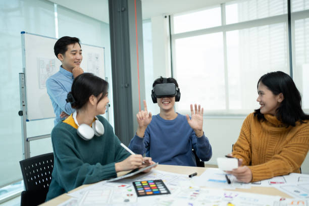 istock A group of tech developers having a meeting in the office, discussing and testing the new version of virtual game on VR glasses. 1505595346
