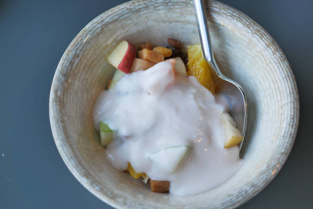 fresh yogurt in a bowl on table .