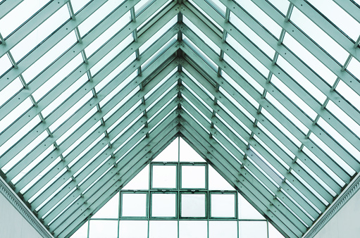 Roof of modern building. Glass and metal construction. abstract architectural background.