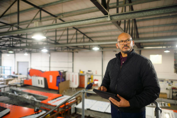 istock Manager monitoring progress in a huge warehouse 1505641746