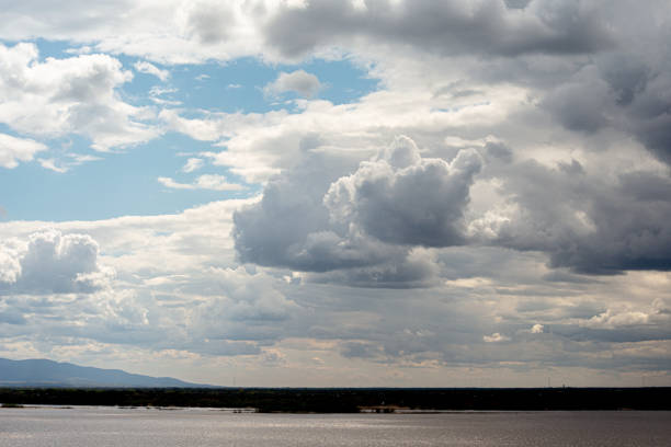 large clouds of different shapes against a blue sky background. High quality photo