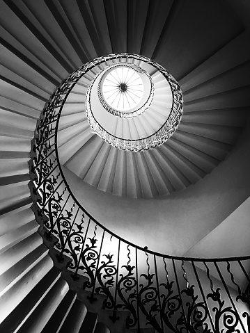 Staircase leading down to the star at the bottom floor. Toned black and white