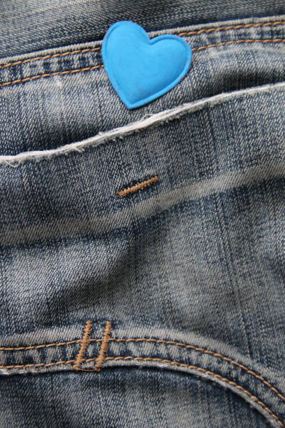 istock Blue heart on jeans. Birthday background. 1505678403
