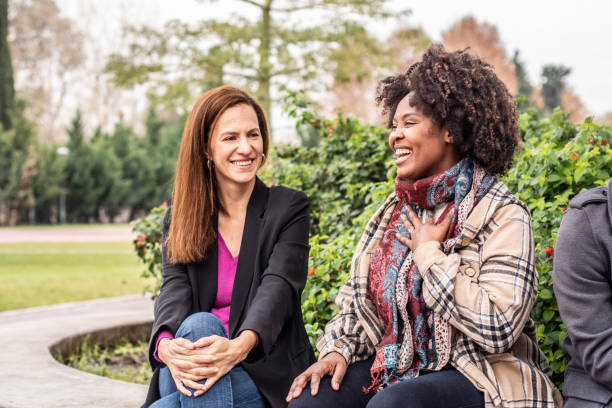 istock Female friends talking in the town square 1505732080
