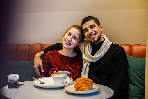 Portrait of a young couple having a date at coffee shop