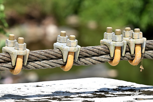 Close up of steel wire rope lifeline on suspension bridge