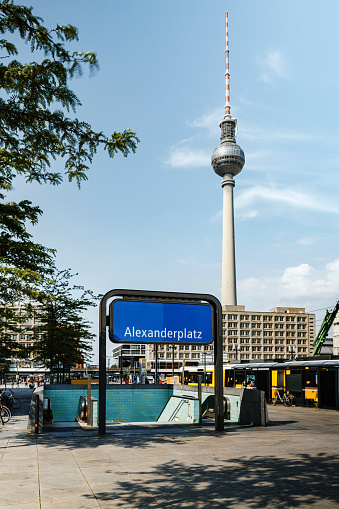 Sign of Subway Station Alexanderplatz: A bustling metropolitan hub with iconic landmarks, vibrant streets, and a modern urban atmosphere.\nTV Tower in the background