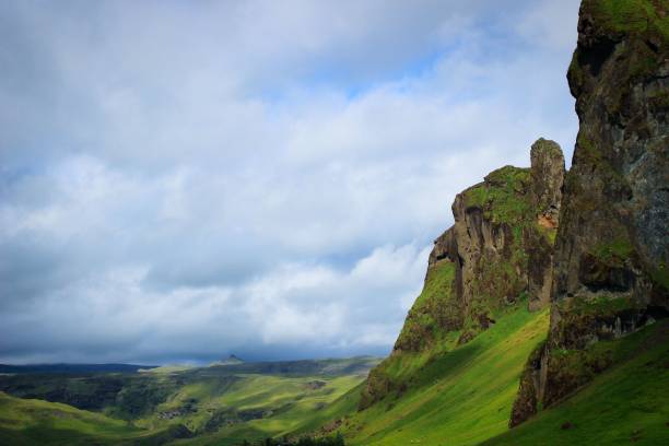 istock Stunning landscape featuring rolling green fields set against a backdrop of majestic mountains 1505781281