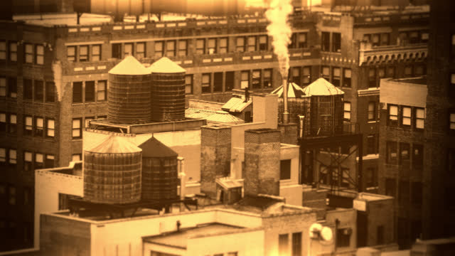 NYC Manhattan roof wooden water tanks industrial vintage film look sepia bokeh