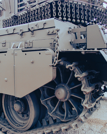 An extreme shot of a fixed battle tank track at an unknown location. For background.