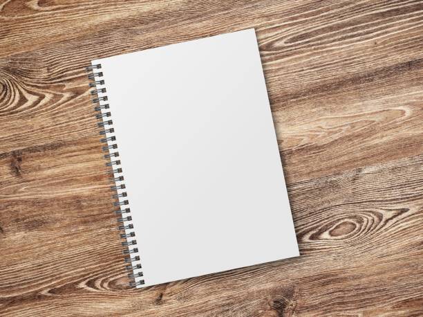 istock Stack of blank paper sheets for brochure on wooden background, top view. Mock up 1505825532
