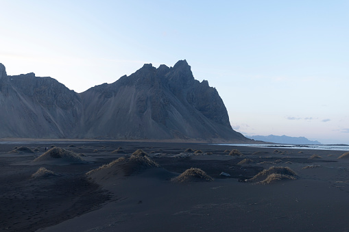 Vestrahorn Mountains in Iceland, Stokksnes Beach peninsula creates a magnificent Icelandic landscape. Beautiful Nordic landscape with black sand beach, scenic route