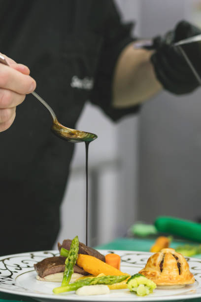 istock Michelin Star Chef is making final touch to the plate 1505902298