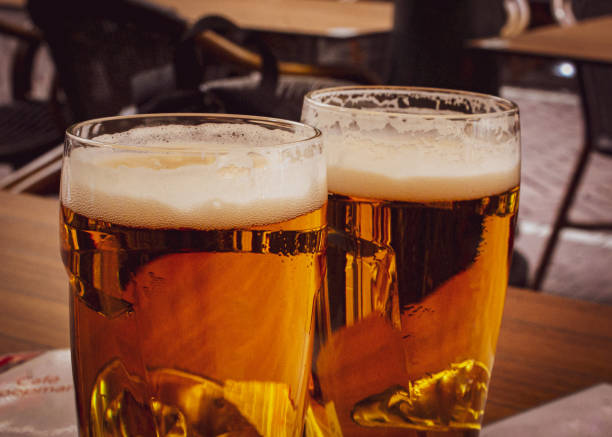 istock Two glasses of beer standing on a table 1505923606