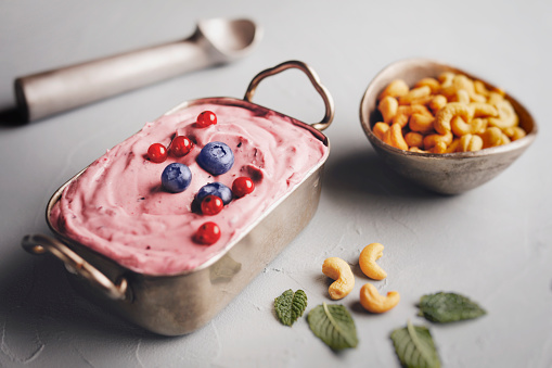 Lactose free cashew milk ice cream with berry fruits