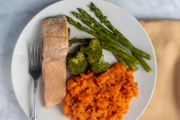 istock salmon fillet  with asparagus , broccoli and mashed carrots 1505934648