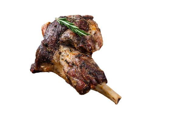 istock Baked lamb mutton leg meat on a wooden cutting board.  High quality Isolate, white background. 1505957840