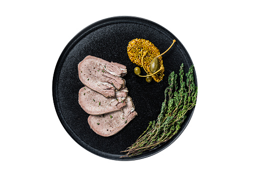 Veal or beef boiled tongue slices on a plate.  High quality Isolate, white background