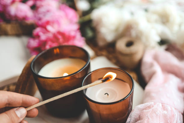 istock Match in hand lights a candle, atmospheric photo 1505973152