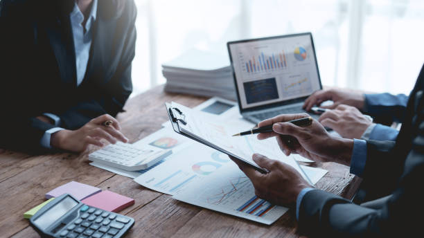 istock Successful Business Team Meeting Pointing at Graph for Strategic Planning and Growth. Teamwork Meeting with Graph Analysis and Collaboration. Corporate Collaboration and Analysis Concept. 1505989050