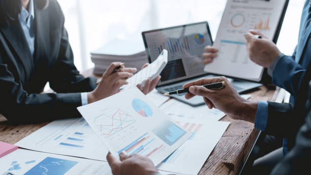 istock Successful Business Team Meeting Pointing at Graph for Strategic Planning and Growth. Teamwork Meeting with Graph Analysis and Collaboration. Corporate Collaboration and Analysis Concept. 1505989057