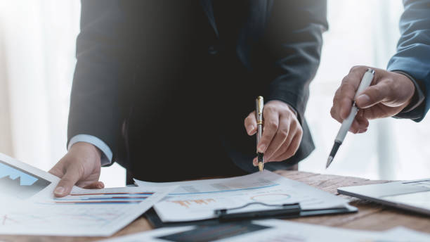 istock Successful Business Team Meeting Pointing at Graph for Strategic Planning and Growth. Teamwork Meeting with Graph Analysis and Collaboration. Corporate Collaboration and Analysis Concept. 1505989068