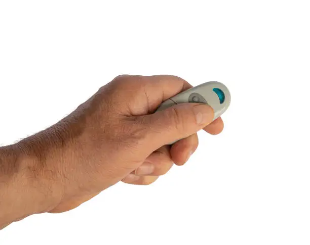 a male hand with the remote control isolated on a transparent background