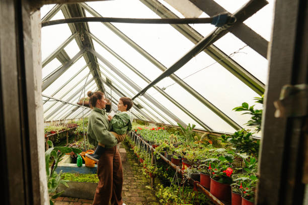 istock Mother and son in their nursery garden 1506031503