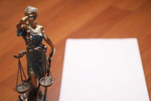 Hispanic Lady justice holding scales and sword