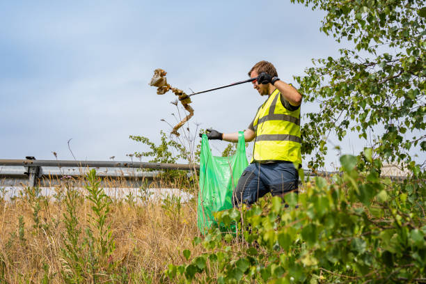 istock Young volunteer picking up litter in the nature 1506061995