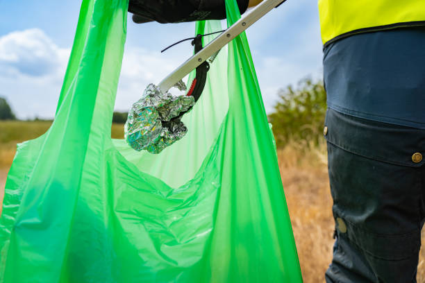 istock Young volunteer picking up litter in the nature 1506062054