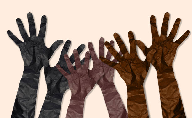 istock Crumpled paper cut hands raised up on beige background, unification concept 1506077734