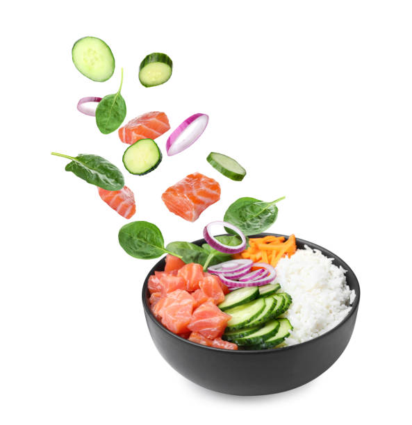 istock Poke recipe. Different ingredients falling into bowl on white background 1506160993