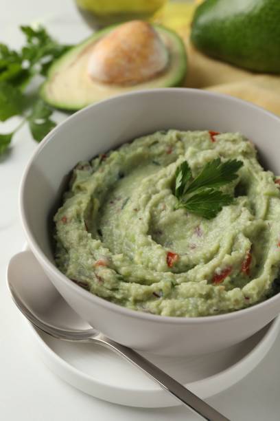 istock Delicious guacamole served on white table, closeup 1506162701