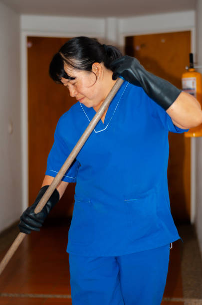 istock cleaning woman sweeping the building halls 1506179974