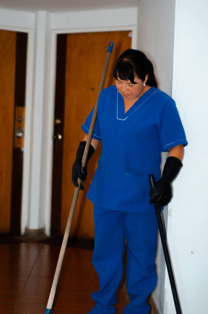 istock cleaning woman sweeping the building halls 1506179982
