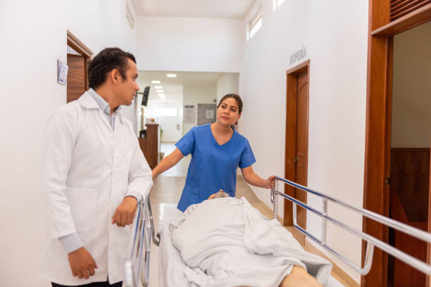 istock Patient transferred on a stretcher by the hospital. 1506243759