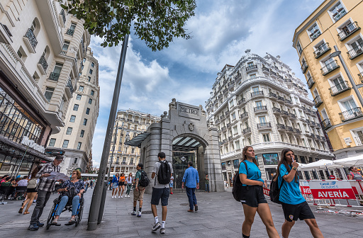 Madrid, Spain - June 20, 2023: View of the commercial area of busy pedestrian street of Montera, in Madrid. Calle de la Montera is an old urban thoroughfare in the Spanish city of Madrid, in the Sol neighborhood of the Centro district.
