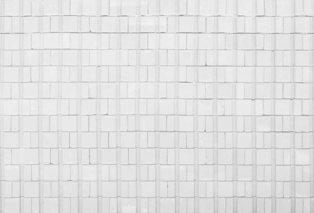 istock White tile wall chequered background bathroom floor texture. Ceramic wall and floor tiles mosaic background in bathroom and kitchen clean. Design pattern geometric with grid wallpaper decoration pool. 1506270720